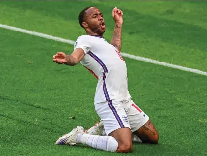  ??  ?? England's Raheem Sterling celebrates after scoring his team's first goal during the Euro 2020 soccer championsh­ip group D match between the Czech Republic and England at Wembley stadium, London, Tuesday, June 22, 2021. (Neil Hall/Pool Photo via AP)