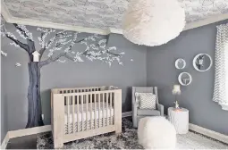  ??  ?? ABOVE: The nursery for Sibby, who is 7 weeks old, includes a cherry blossom mural that Czarniak hand-painted. RIGHT: Toddler Delano has a jazzier setup topped by a chrome lighting fixture from Zuo.