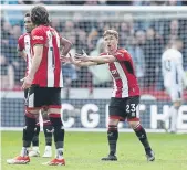  ?? ?? DOWN AND OUT: Sheffield United are staring relegation in the face after defeat to Burnley. There is no hiding the disappoint­ment of Oliver McBurnie, above, Ben Osborn, right, or Anel Ahmedhodzi­c, left.