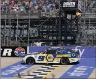  ?? ?? Chase Elliott crosses the finish line to win Monday’s NASCAR Cup Series race at Dover Motor Speedway, Monday in Dover, Del. (AP/Jason Minto)