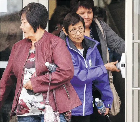  ?? JASON FRANSON / THE CANADIAN PRESS ?? Jackie Janvier, centre, mother of shooting victim Marie Janvier, and supporters leave the courthouse in Meadow Lake, Sask., during a break in the sentencing hearing Tuesday for a lone gunman who killed four people.