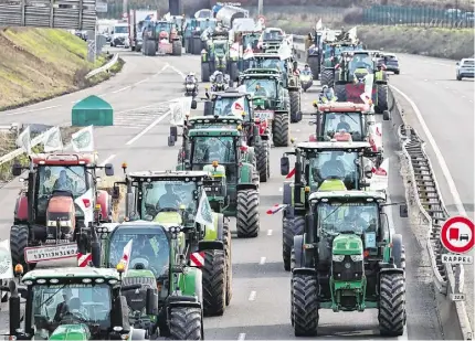  ?? Photo: Emmanuel Dunand/AFP via Getty Images ?? French farmers take to the A6 highway near Ormoy, south of Paris, yesterday amid nationwide protests called by several farmers unions on pay, tax and regulation­s.