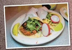  ?? ?? Try the chilaquile­s (right) and tacos (left) from The Haab Mexican Cafe in Queens.