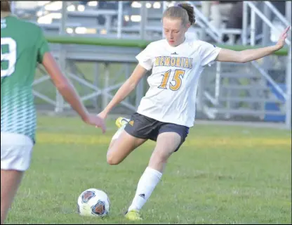  ?? Staff photo/Jake Dowling ?? St. Marys’ Ella Jacobs (15) attempts a direct kick in the first half of a Western Buckeye League girls soccer match on Tuesday against Celina.