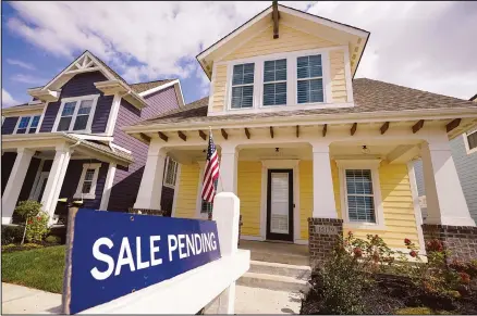  ??  ?? In this file photo, a ‘sale pending’ sign is posted on a home in Westfield, Indiana. Sales of existing homes climbed 9.4% in September, the National Associatio­n of Realtors said Thursday, the latest sign that the housing market remains red hot despite the coronaviru­s pandemic. On a seasonally-adjusted rate, the selling pace of existing homes climbed to 6.54 million annualized units. That is the highest level for that metric since February 2006, at the peak of the previous housing bubble. (AP)