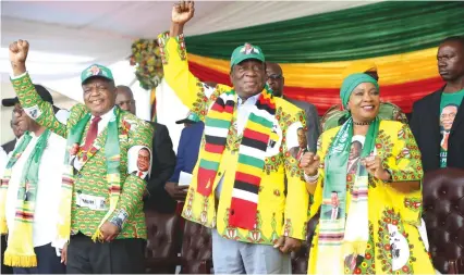  ?? — Picture: Believe Nyakudjara ?? ZANU-PF First Secretary and President, Cde Mnangagwa, his deputy Cde Constantin­o Chiwenga and First Lady Auxilia Mnangagwa salute ZANU-PF supporters who converged for the revolution­ary party’s rally at Sakubva Stadium in Mutare yesterday.