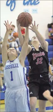  ??  ?? Rossville’s Kyra Bautista fights for a rebound against Lakeview’s Lexi Downey during an NGAC contest at RMS last week.