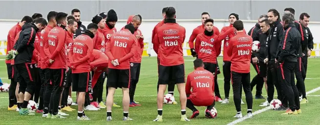  ??  ?? Chile players listening to instructio­ns during their training session in St Petersburg, Russia, on Friday. — AP Paying attention: