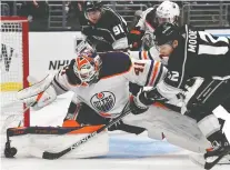  ?? GARY A. VASQUEZ/USA TODAY SPORTS ?? Oilers goaltender Mike Smith stops a shot from Los Angeles Kings centre Trevor Moore during Thursday's Game 6 of their first-round playoff series at Crypto.com Arena. The Oilers forced a Game 7 with a 4-2 win.