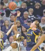  ?? STEPHEN DUNN/THE ASSOCIATED PRESS ?? Quinnipiac's Jen Fay, right, battles for a rebound against Miami's Lauren Dickerson. Fay had 19 points in the 86-72 win in the women’s NCAA Tournament in Storrs, Conn.