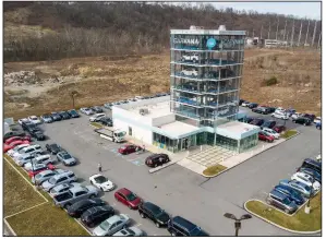  ?? (AP) ?? A Carvana vending location is shown last month in South Fayette, Pa. The projected accelerati­on of U.S. auto sales is part of a trend that began soon after factories reopened last summer.