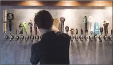  ?? CP PHOTO/STEPHEN MACGILLIVR­AY ?? Bartender Noah Lauffer pours a craft beer at James Joyce Pub in the Crowne Plaza Hotel in Fredericto­n, N.B., on June 16, 2017. Partying into the wee hours of the morning at your favourite watering hole is a tradition generally reserved for New Year's...