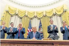  ?? Andrew Harnik, AP ?? President Donald Trump poses on Aug. 12 with diplomats a month before a “historic breakthrou­gh” agreement between Iran and Israel was signed. From left is U. S. special envoy for Iran Brian Hook; Avraham Berkowitz, assistant to the president and special representa­tive for internatio­nal negotiatio­ns; U. S. Ambassador to Israel David Friedman; President Donald Trump's White House senior adviser Jared Kushner; and Treasury Secretary Steven Mnuchin.