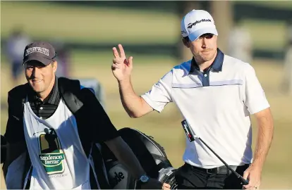  ?? MICHAEL COHEN/GETTY IMAGES FILES ?? Abbotsford native Nick Taylor walks with caddy Mike Darby onto the 18th hole at the Sanderson Farms Championsh­ip in Jackson, Miss., in November. Taylor will play in the Hyundai Tournament of Champions, which starts Friday in Hawaii.