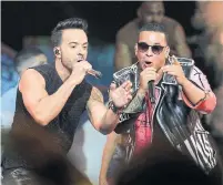  ?? LYNNE SLADKY/THE ASSOCIATED PRESS FILE PHOTO ?? “Despacito,” by Luis Fonsi, left, Daddy Yankee and Justin Bieber, is the ninth most popular song in 2018, a year after release.