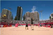  ??  ?? The high rises of Surfers Paradise form the backdrop as Kiwi beach volleyball­ers Ben O’Dea and Sam O’Dea beat Cyprus 2-1.