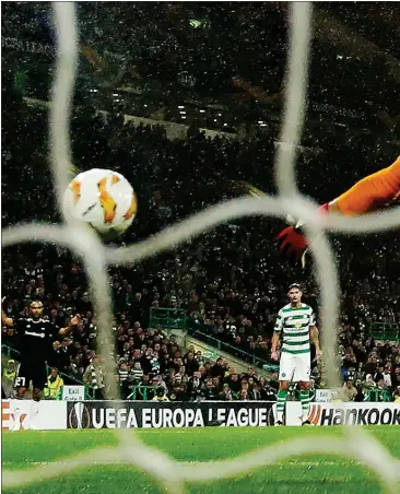  ??  ?? Celtic striker Leigh Griffiths nods in the winner for the hosts after a trying time