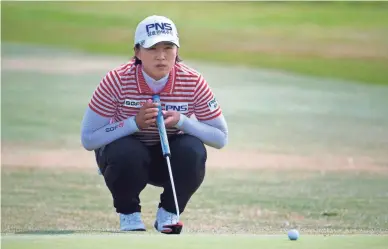  ?? AP ?? Amy Yang lines up a shot on the fourth green during the CP Women’s Open on Friday in Regina, Saskatchew­an.