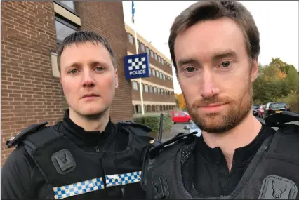  ??  ?? Above, officers Daniel White and Alexander McCullough. Below, police seal off West Nile Street after the knifeman attacked