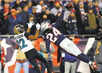  ?? Kevin C. Cox / Getty Images ?? New England cornerback Stephon Gilmore deflects a pass intended for the Jaguars’ Dede Westbrook during the fourth quarter. The play helped end Jacksonvil­le’s Super Bowl hopes.