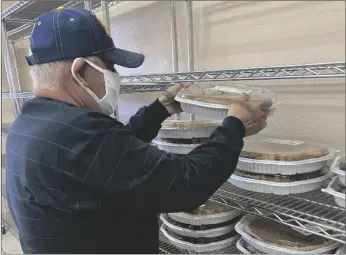  ?? ELIZABETH MAYORAL CORPUS PHOTO ?? Besides hot plates with Thanksgivi­ng dinner, volunteers stacked pies to serve as dessert for community members at Brawley Feed the Need, Nov. 24, in Brawley.