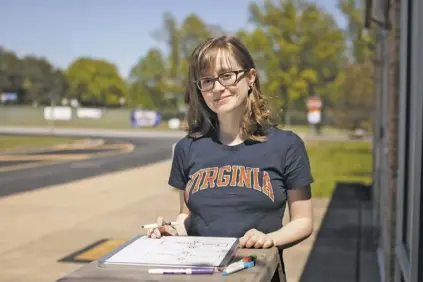  ?? BY LUKE CHRISTOPHE­R FOR FOOTHILLS FORUM ?? RCHS senior Lauren Petty,
seen here drawing a chart using systems engineerin­g — which she will study this fall either on or off campus at UVA — hopes to one day use her college degree “to focus on public health systems and optimize vaccine distributi­on.”