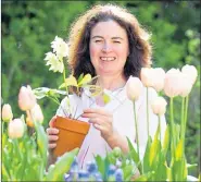  ??  ?? Post gardening expert Agnes Stevenson tending her plants