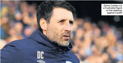  ??  ?? In associatio­n with
Danny Cowley cut a frustrated figure on the sidelines against Cardiff