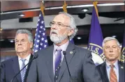  ?? J. SCOTT APPLEWHITE / AP ?? Rep. Dan Newhouse (center), R-Wash., flanked by Rep. Peter King (left), R-N.Y., and Rep. Fred Upton, R-Mich., encourage support for the Deferred Action for Childhood Arrivals program Thursday.