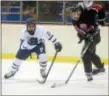  ?? TRENTONIAN FILE PHOTO ?? Princeton’s Robert Trainor, left, and Robbinsvil­le’s Jack Pallitto chase after the puck during CVC action.