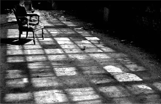  ?? TAMMY HOY PHOTO ?? This photo of an old chair in an abandoned warehouse in Toronto is one of a group of photograph­s taken by the Toronto Urban Exploratio­n and Adventure Group.