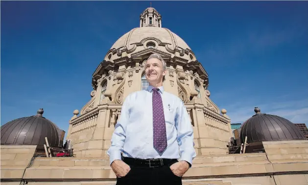  ?? Photos: Greg Southam/ Edmonton Journal ?? Lyle Butchart, area manager for Government Centre, stands on the roof of the Alberta legislatur­e, in front of the main dome. The terra cotta tile on the dome will be replaced during renovation­s, projected to cost between $8 million and $10 million.