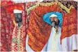  ??  ?? Ethiopian priests carry covered tabots on their heads during an epiphany festival