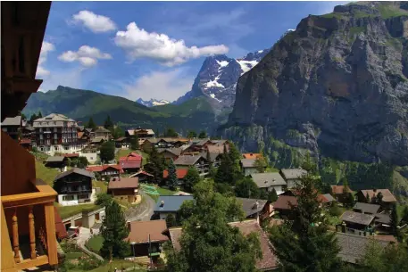  ??  ?? HIGH UP: The Alpenruh Hotel in Murren offers terrace rooms with sweeping vistas over the picturesqu­e mountain town and surroundin­g Alpine peaks.