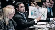  ?? WASHINGTON POST ?? Rep. Henry Cuellar shows a border map at a meeting last month. He’s “cautiously optimistic,” a deal will be reached.