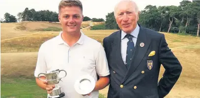  ??  ?? Josh Turnock receives the Champions Trophy from Chris Moore CBE; Dave Green