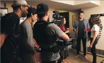  ?? MICHELLE BERG ?? From left, Royal Bull Films director Jacob Stebner, Dawson Heistad and Spencer Zimmerman run through a scene from The Tipping Point, featuring lead actor Ben Thomas.