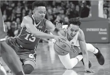  ?? TRAVIS HEYING/THE WICHITA EAGUE VIA AP ?? Wichita State’s Landry Shamet, right, fights for the ball against Oklahoma guard Jordan Shepherd during Saturday’s game in Wichita, where the Sooners upset the No. 3 Shockers 91-83.