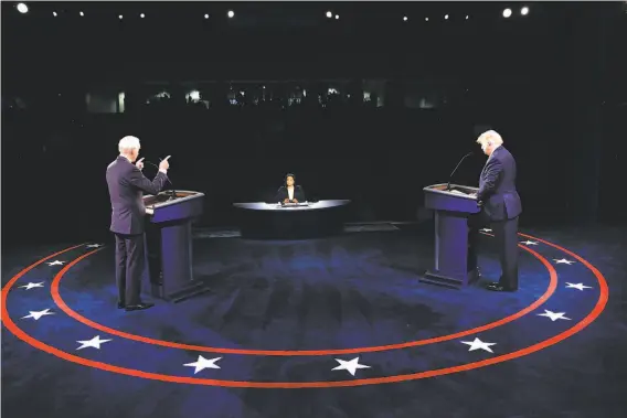  ?? Jim Bourg / Associated Press ?? Former Vice President Joe Biden ( left) and President Trump debate for the last time 12 days before election day as moderator Kristen Welker listens.