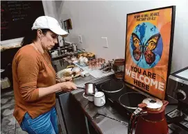  ?? Arnold Gold/Hearst Connecticu­t Media ?? Hana Eabid prepares coffee and tea for customers at the Havenly Cafe on on Feb. 29.