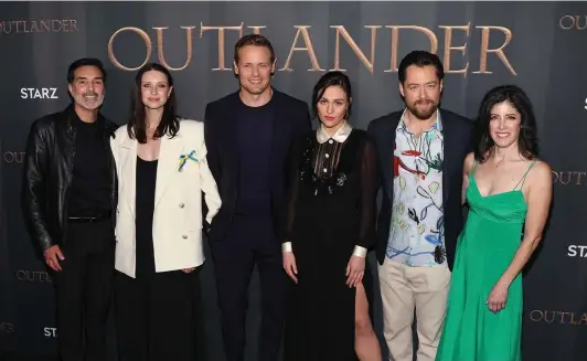  ?? DAVID LIVINGSTON/GETTY IMAGES/TNS ?? From left, Matthew B. Roberts, Caitriona Balfe, Sam Heughan, Sophie Skelton, Richard Rankin and Maril Davis attend the Season 6 Premiere of STARZ “Outlander” on March 9 at The Wolf Theater at the Television Academy in North Hollywood, California.