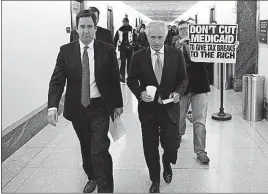  ?? [TOM BRENNER/THE NEW YORK TIMES] ?? A protester follows Sen. Bob Corker, R-Tenn., outside Senate offices on Capitol Hill on Monday.