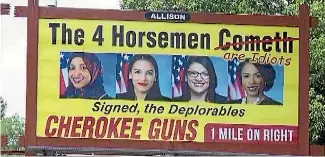  ??  ?? Democratic congress women, from left, Ilhan Omar, of Minnesota, Alexandria Ocasio-Cortez, of New York, Rashida Tlaib, of Michigan, and Ayanna Pressley, of Massachuse­tts, feature on a gun shop’s billboard in North Carolina.