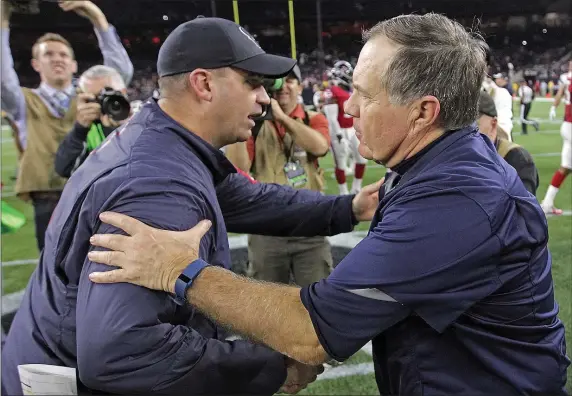  ?? HERALD STAFF PHOTO BY MATT STONE ?? Houston Texans head coach Bill O’Brien, left, and New England Patriots head coach Bill Belichick shake hands after the Patriots beat the Texans, 27-6, in 2015. Rival teams are praising the Patriots for their coaching moves, including bringing back O’Brien.