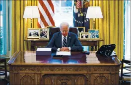  ?? DOUG MILLS — THE NEW YORK TIMES ?? President Joe Biden makes remarks before signing the American Rescue Plan, the $1.9 trillion COVID-19 relief package, in the Oval Office of the White House on March 11.