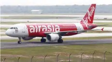  ?? — Reuters ?? Airasia Airbus A320 plane arrives at Kuala Lumpur Internatio­nal Airport 2 (KLIA2) in Sepang, Malaysia.