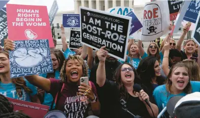  ?? JOSE LUIS MAGANA/AP ?? Anti-abortion supporters celebrate Friday in Washington after the Supreme Court overturned Roe v. Wade.