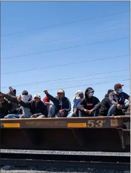  ?? GUILLERMO ARIAS — AFP VIA GETTY IMAGES/TNS ?? Migrant people traveling on a train arrive to Ciudad Juarez, Chihuahua state, Mexico on April 1, 2023.