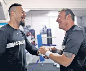  ??  ?? Driving force: The rich boxing pedigree of trainer Kevin Barry (right) is behind the rise of Joseph Parker to WBO heavyweigh­t champion
