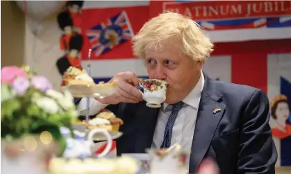  ?? ?? Boris Johnson has a cup of tea during a visit to the Sweetcroft care home in his constituen­cy on Thursday. Photograph: Leon Neal/Getty Images